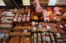 Meat and sausage goods are on sale at a grocery store in St. Petersburg