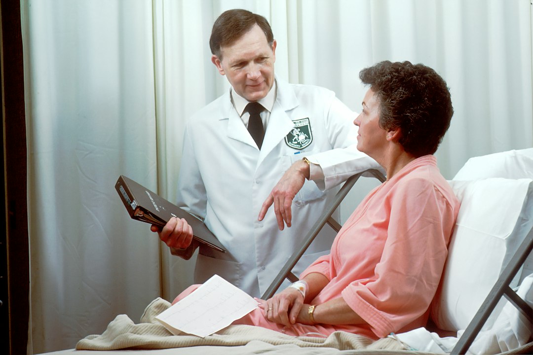 Healthcare provider speaking with a patient during a medical visit