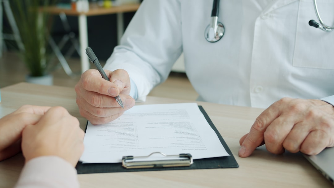 Person reviewing written questions during a medical appointment