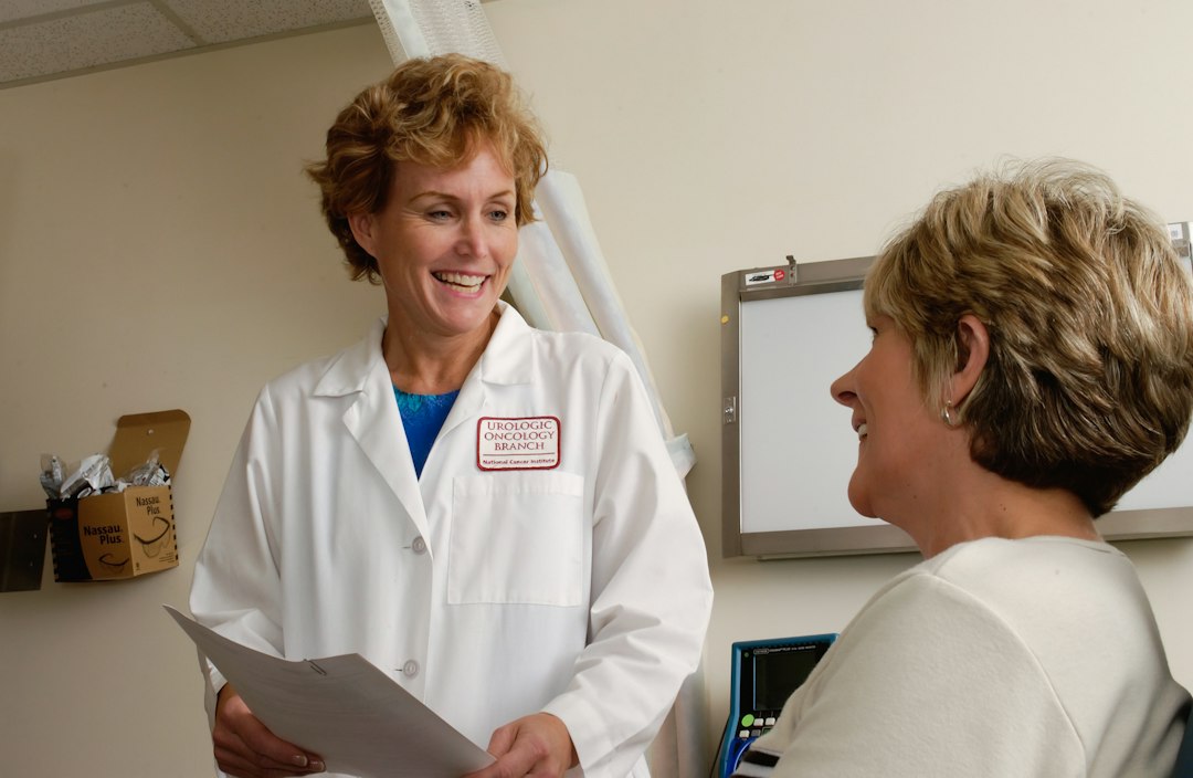 Healthcare professional reviewing information during a medical consultation